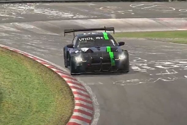 BMW M4 GT3 in a black and green sponsor livery on the Nordschleife in iRacing